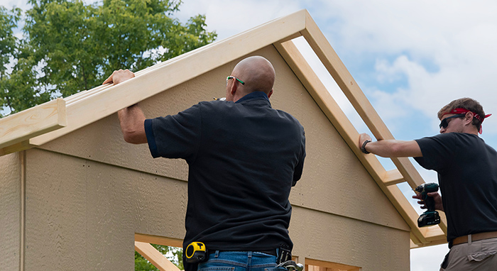 Professional installers building a shed